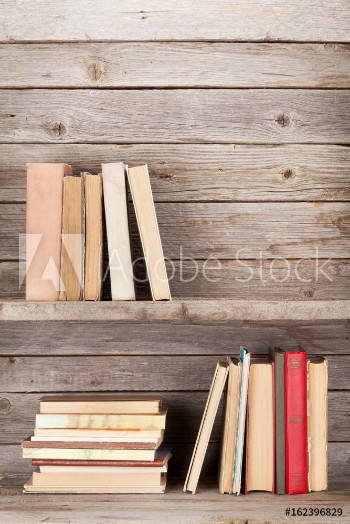 Picture of Old books on a wooden shelf